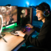 Smiling,young,man,live,streaming,his,online,video,game,using